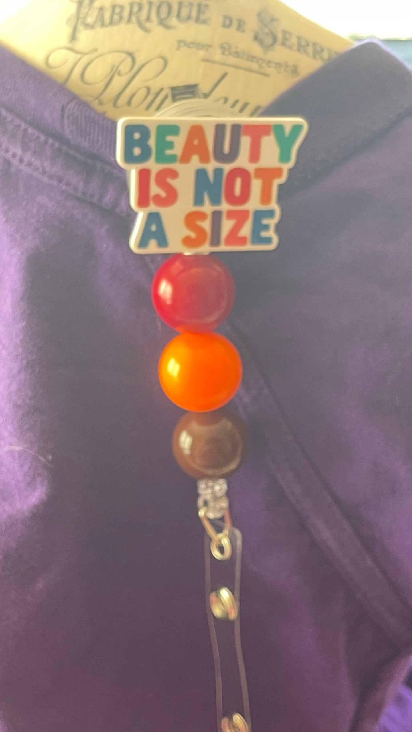 Beauty is not a size badge reel. Retractable with an alligator clip