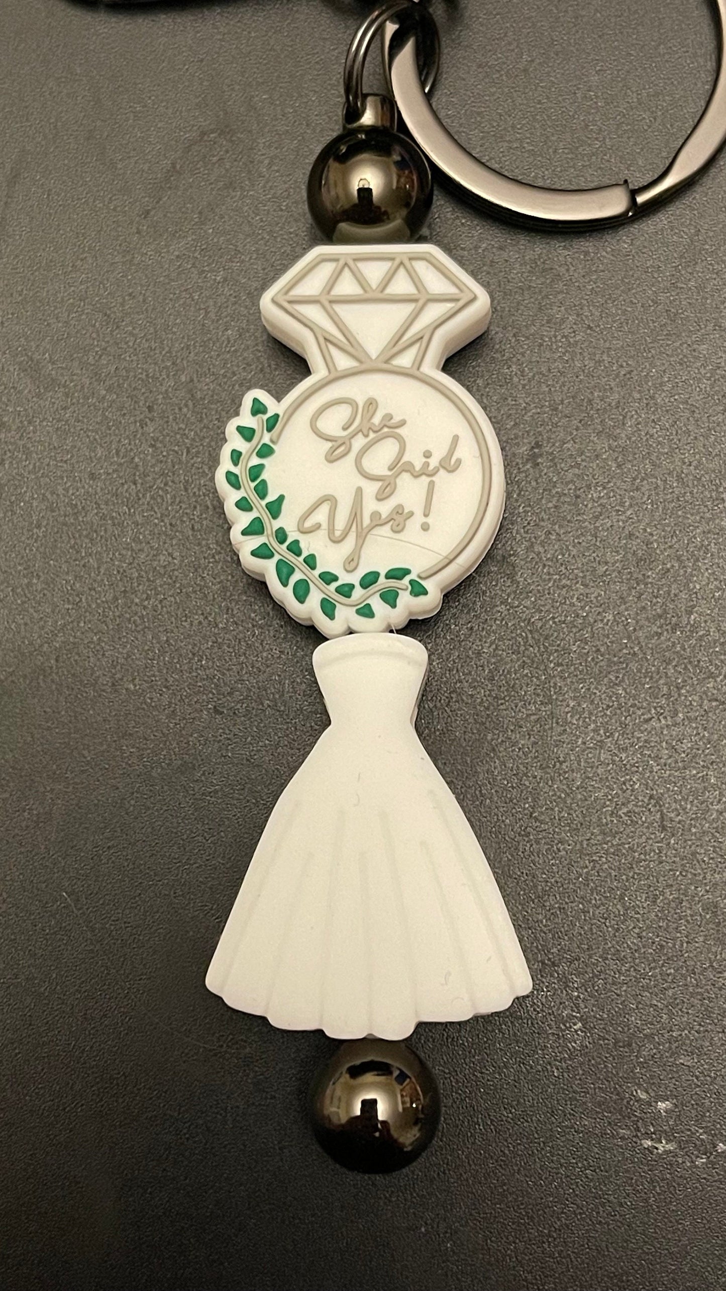 She said yes! Bridal dress keychain or zipper pull. Also can put on purses or backpacks or any bag!