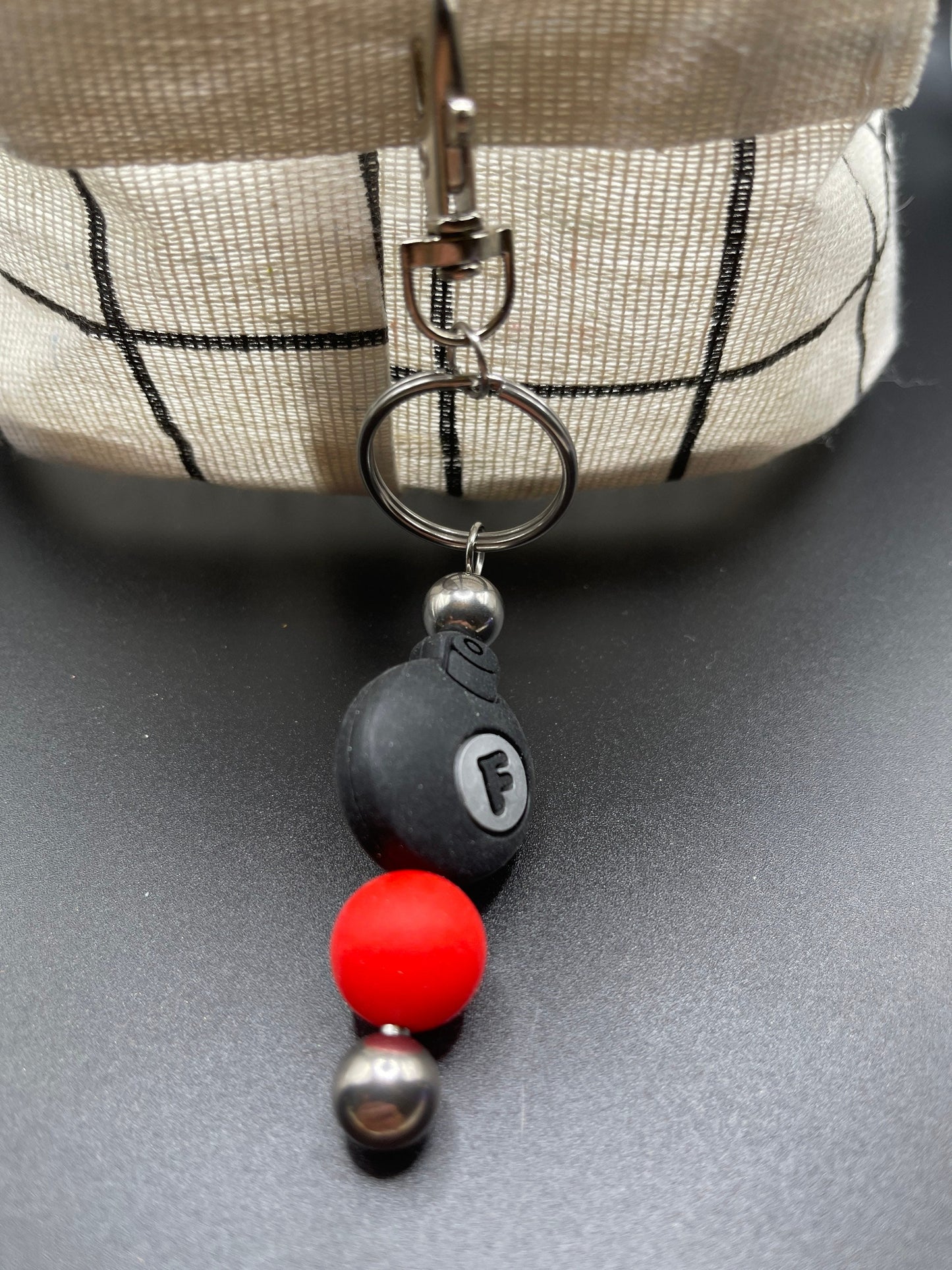 F bomb keychain or zipper pull. Also can put on purses or backpacks or any bag!