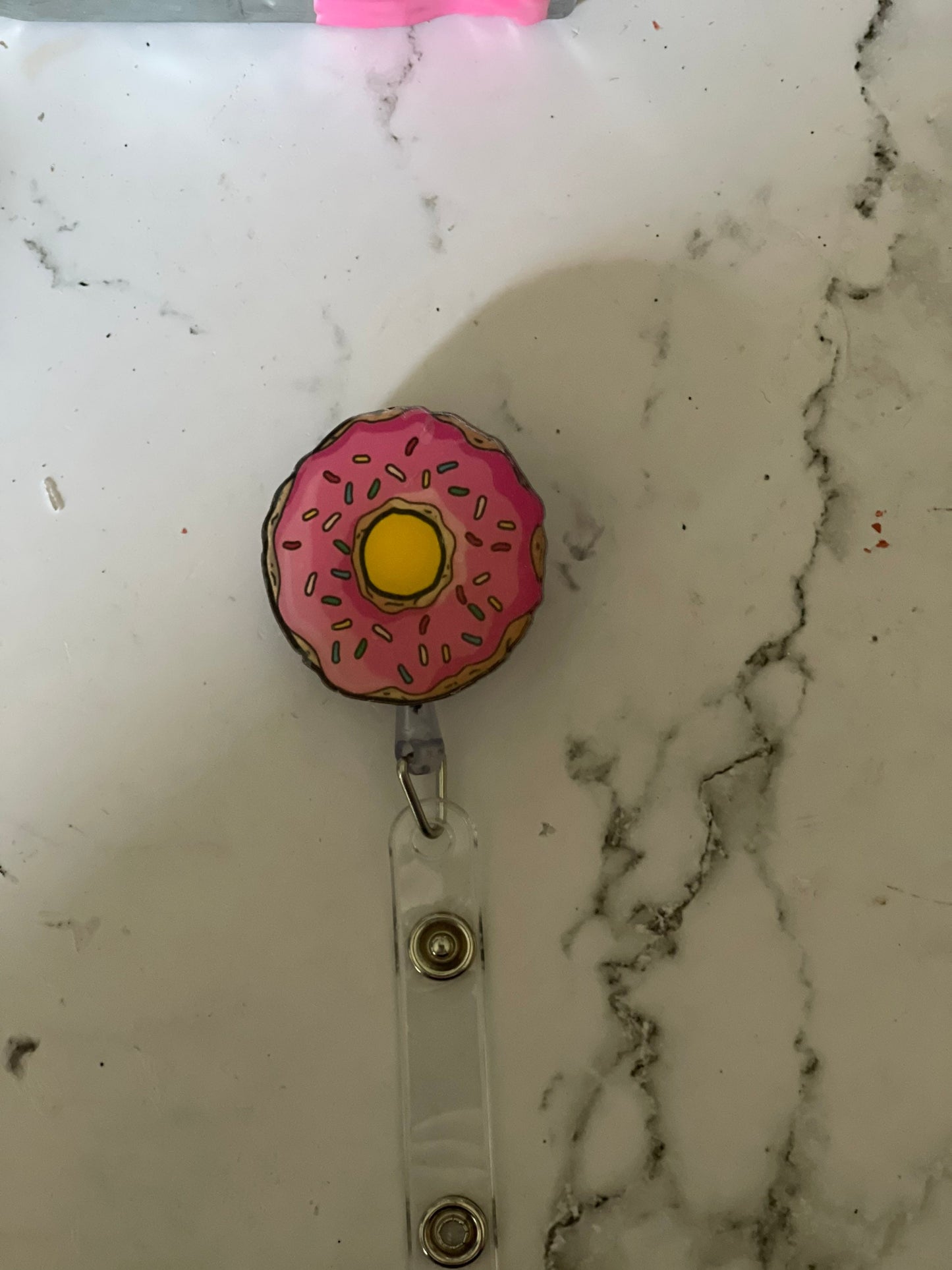 Pink donut retractable badge reel. Nurse badge, teacher badge, vet tech, doctors, warehouse workers