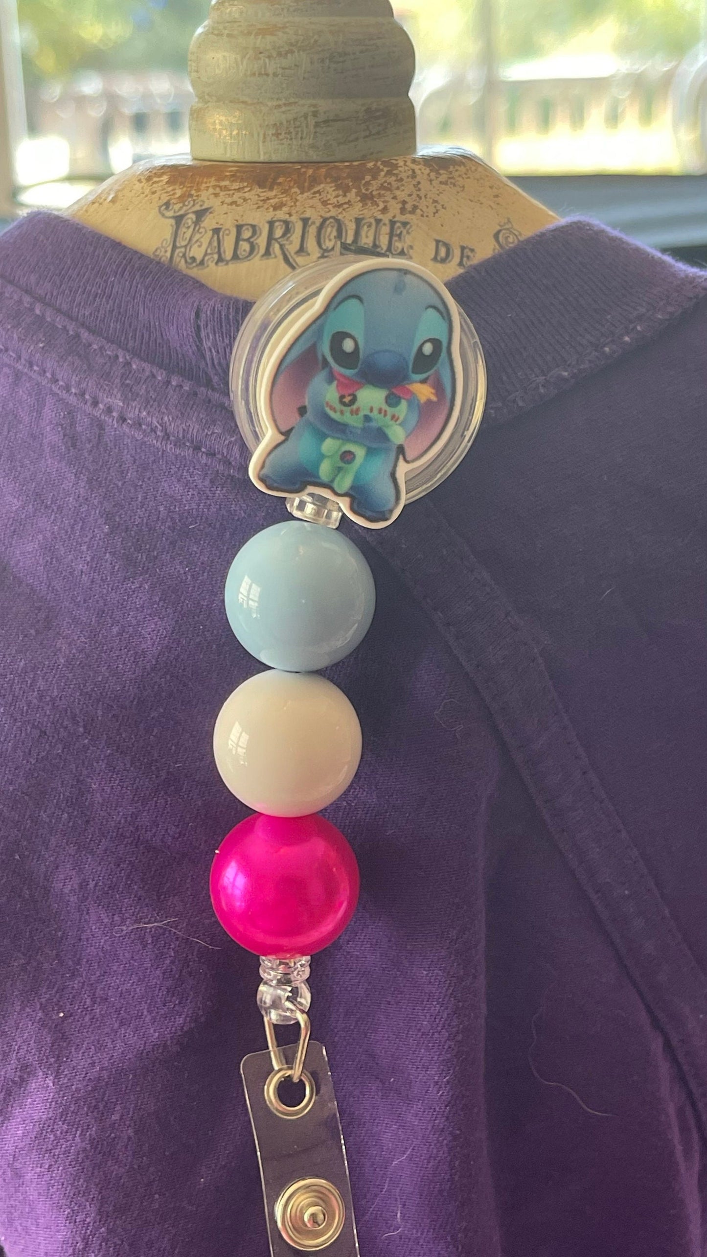 Stitch badge reel. Retractable with an alligator clip