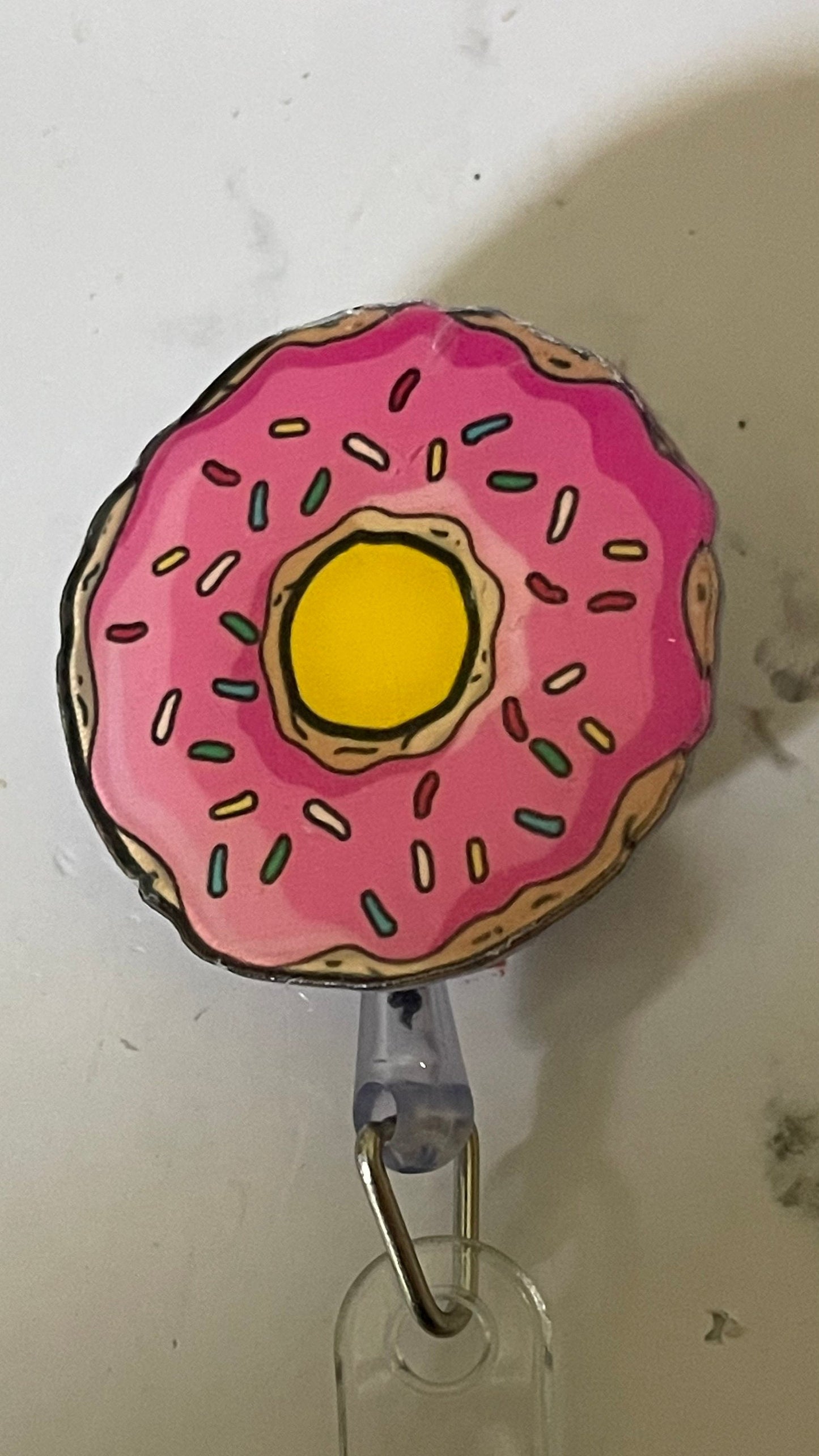 Pink donut retractable badge reel. Nurse badge, teacher badge, vet tech, doctors, warehouse workers