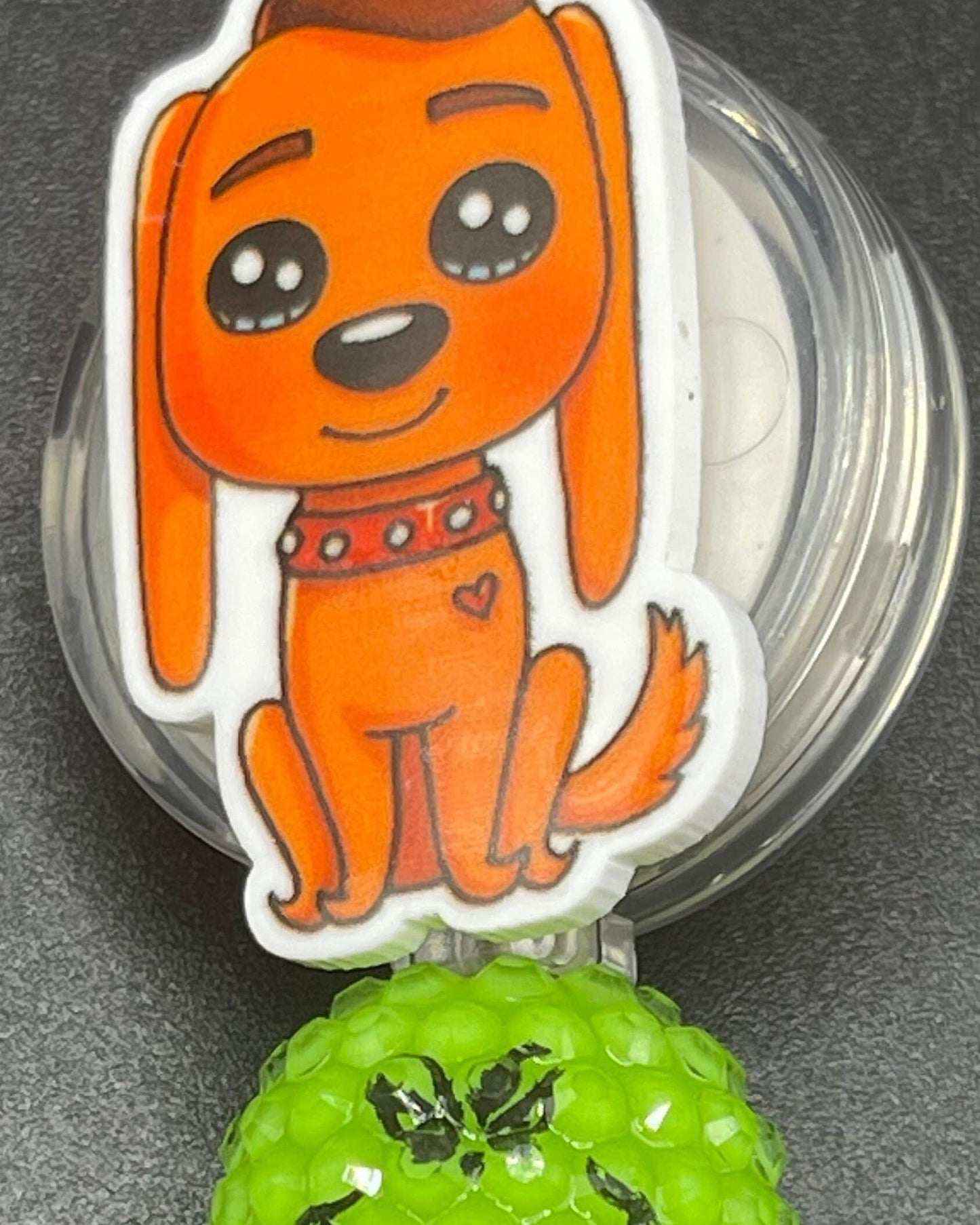 The Grinch dog Max badge reel. Retractable with an alligator clip