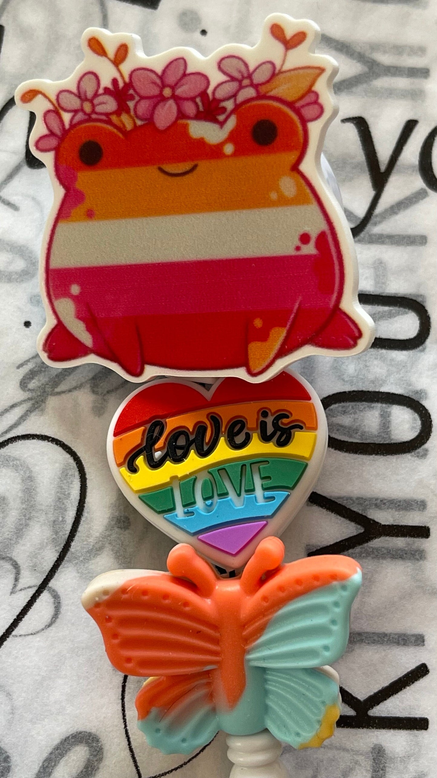 Subtle LGBTQ badge reel, lesbian visibility